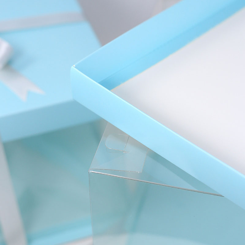 Structure and component detail for clear panel cake boxes with colored frames