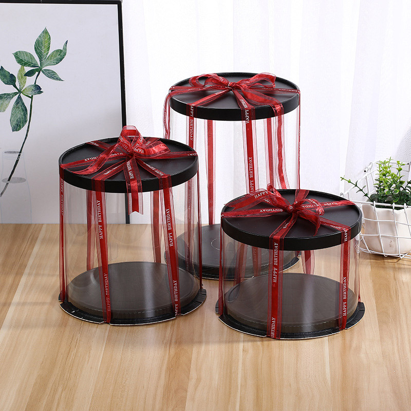 Tall clear round cake boxes with ribbon presentation