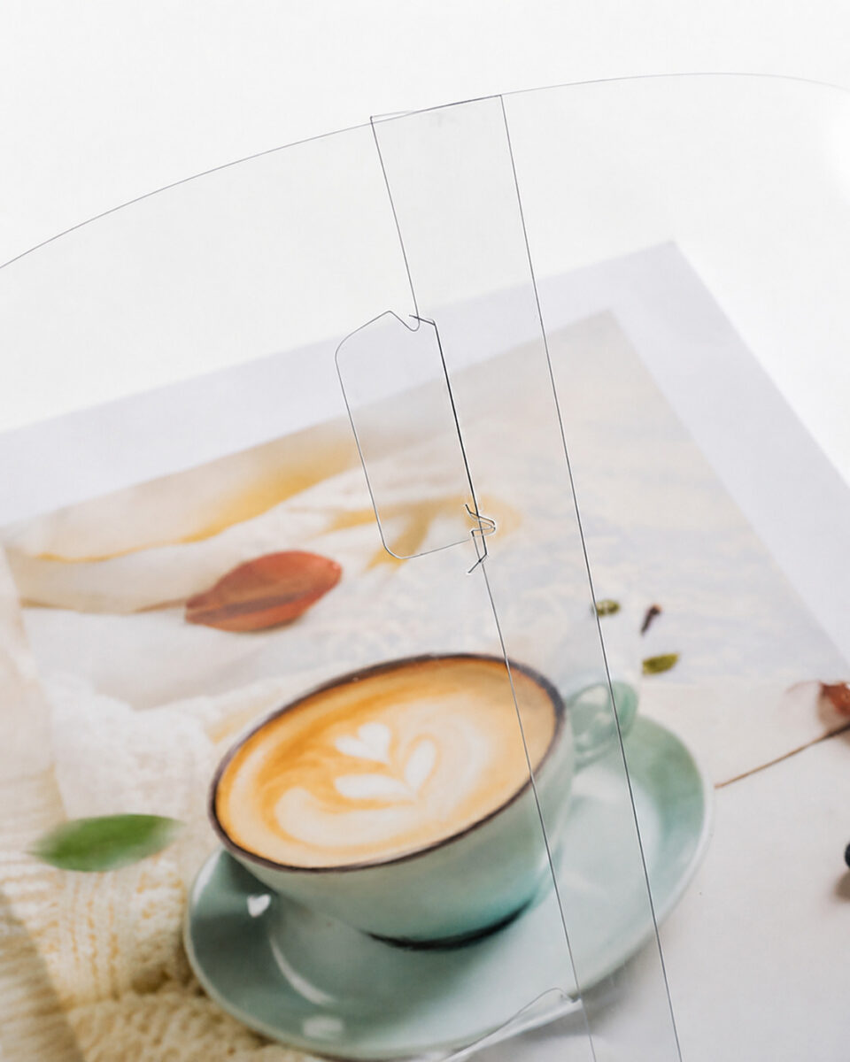 Transparent locking tab and curved side seam of a round cake box