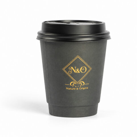 Charcoal paper coffee cup with a black lid and gold Nature and Origins artwork