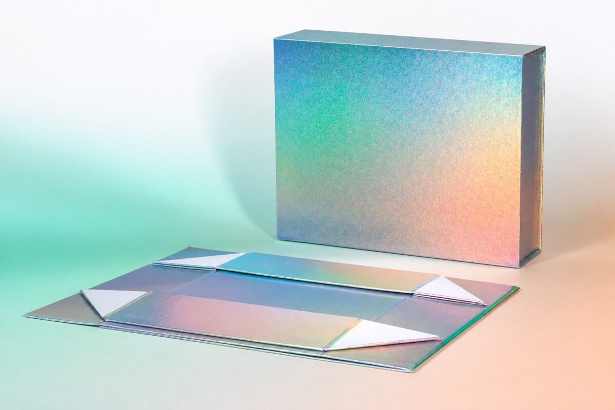 Iridescent folding gift box shown assembled and flat with four adhesive liners