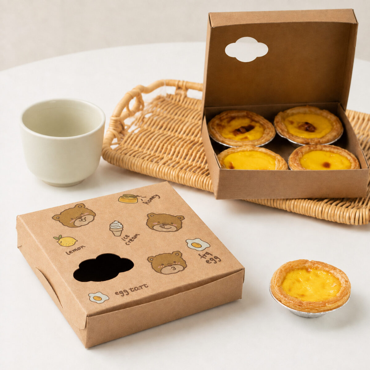 Plan an Egg Tart Gift Set Beyond the Portion Count Kraft egg tart box with bear illustrations and a shaped window beside an open four-tart box