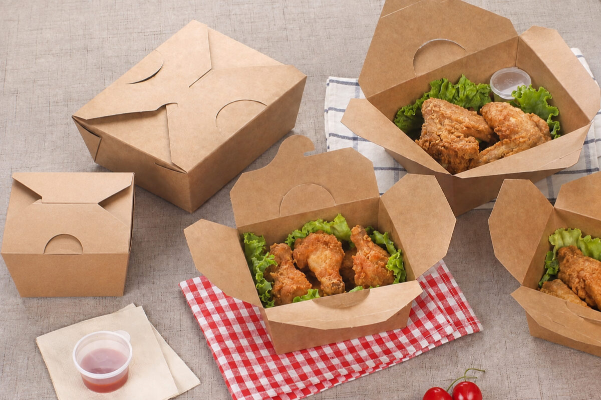 Kraft takeaway cartons with chicken portions on patterned cloths