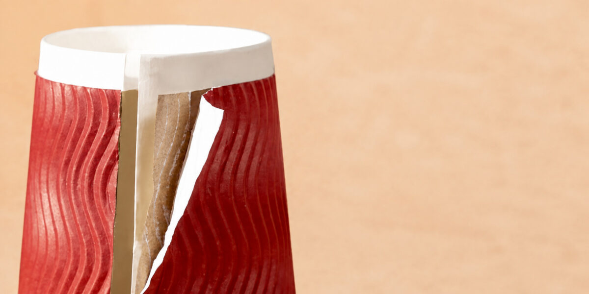 Cutaway close-up of red ripple paper around a white coffee cup liner