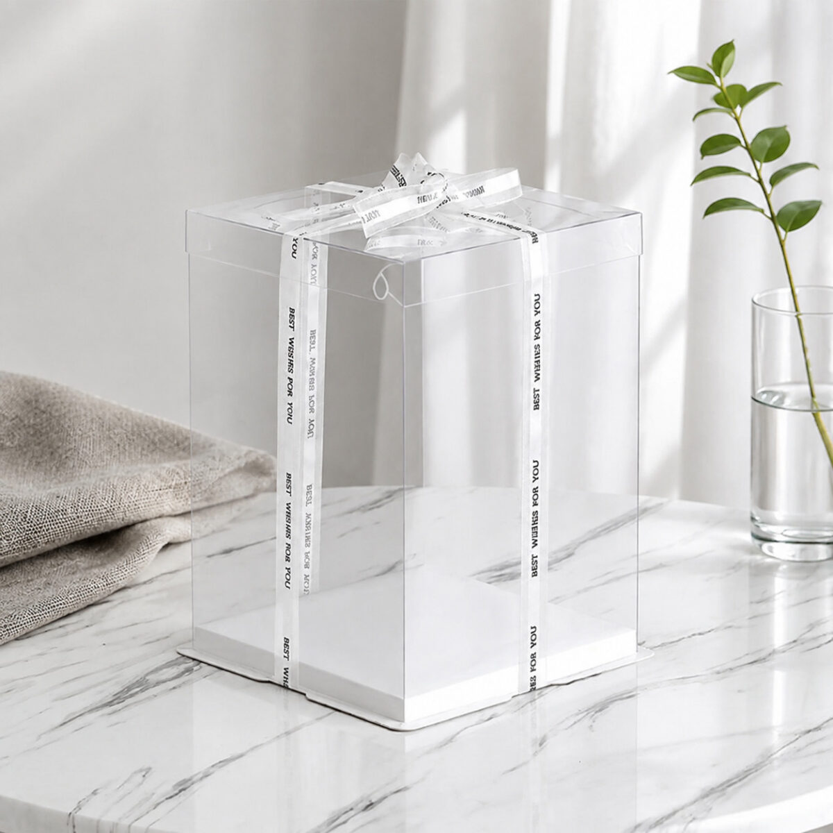 Tall Clear Cake Boxes with Transparent Lids Tall transparent square cake display box with a white base and Best Wishes for You ribbon